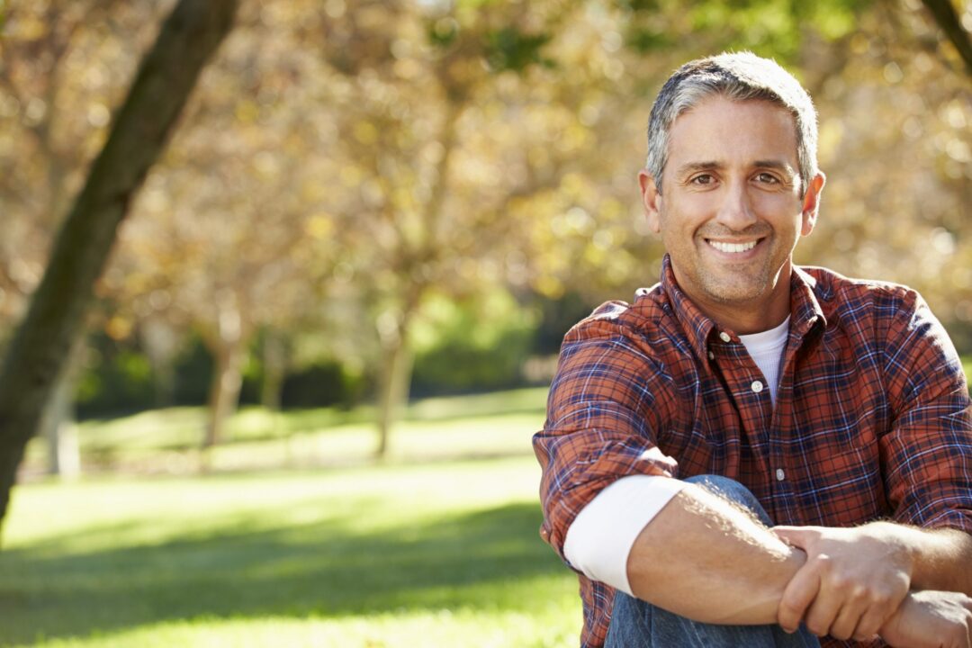 middle aged man smiling after Apex Men's Health Clinic treatment Omaha, NE